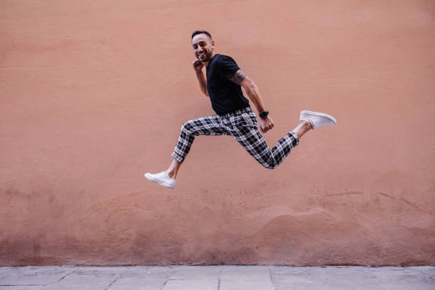 istock Young boy jumping on the street 1082496518