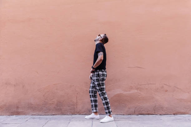 istock Boy posing on the street with sunglasses 1082496524