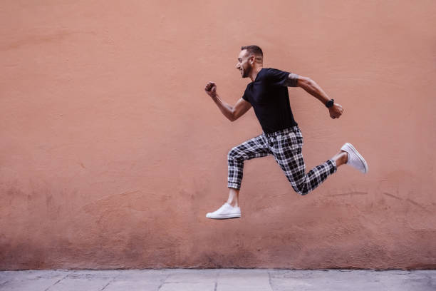 istock Young boy jumping on the street 1082496526