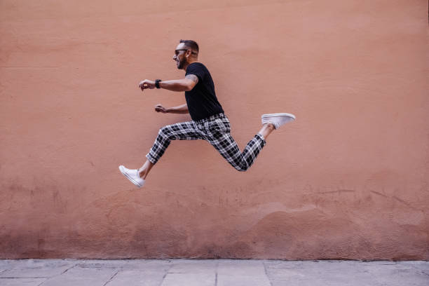 istock Young boy jumping on the street 1082496546