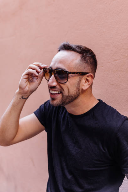 istock Boy posing on the street with sunglasses 1082496550