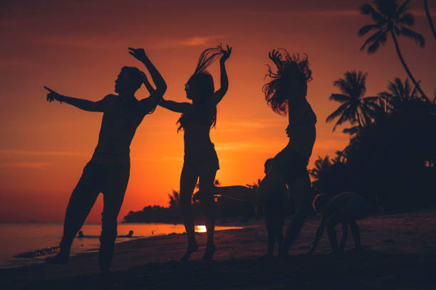 Crowd people friends sunset beach holidays