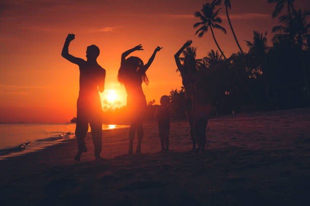 istock friends dancing on a sunset beach 1082498474