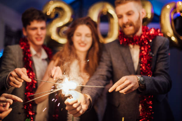 istock Young people firing sparklers 1082500130