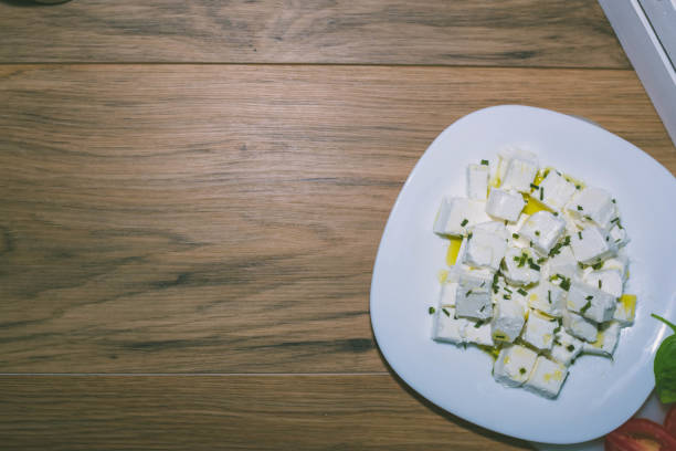 istock Fresh Feta Cheese (detailed close-up shot) on vintage background 1082500176