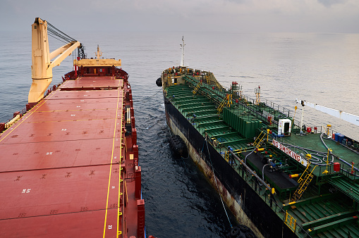 Offshore, Angola - 16 January 2017: Bunker barge at sea,close to Africa ready to perform bunkering of heavy fuel oil and diesel marine oil.