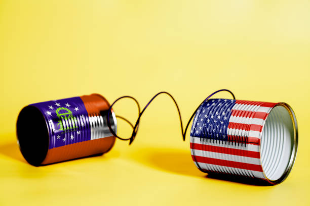 istock tin can phone with USA and Georgia U.S. state Flags. communication concept 1082507200
