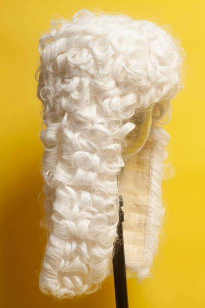 istock Judge wig on yellow background. 1082507248
