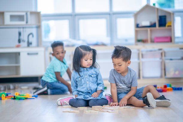 istock Sitting Together At Daycare 1082511630