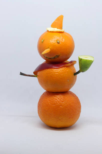 istock Merry Christmas snowman made from tangerines. 1082519422