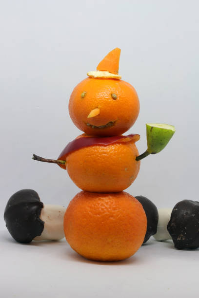 istock Merry Christmas snowman made from tangerines. 1082519478