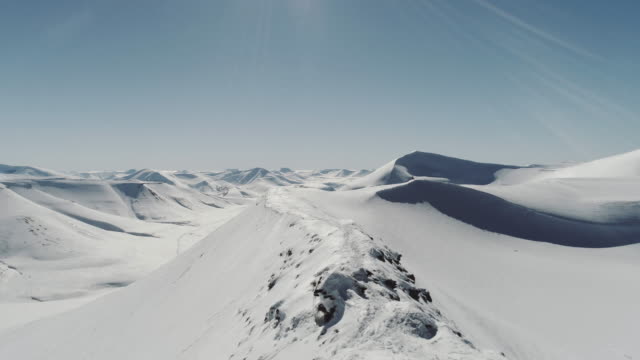 Aerial Drone Footage of Snow Covered Polar Mountains in the Arctic, Svalbard, Norway, SNow Covered Mountains