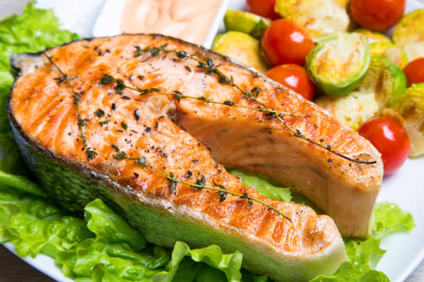 istock Grilled salmon with Brussels sprouts and tomatoes. 1082521072