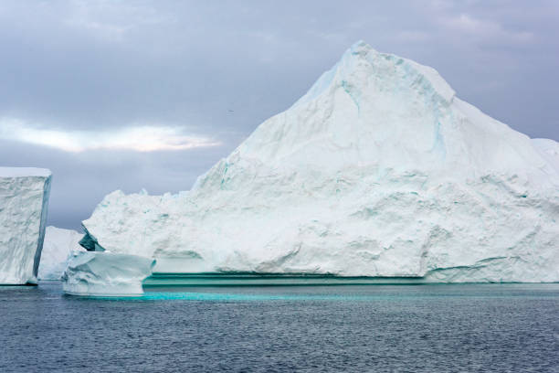 istock Massive Iceberg floating in Arctic Ocean in Greenland 1082524872