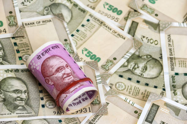 istock New indian 2000 rupees banknotes. 500 rupee banknotes in background. 1082531590