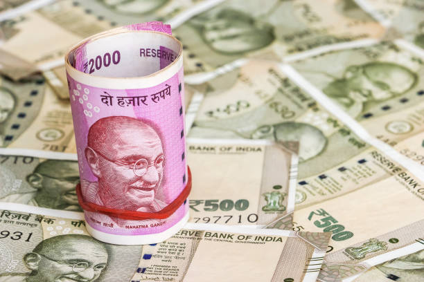 istock New indian 2000 rupees banknotes. 500 rupee banknotes in background. 1082531666