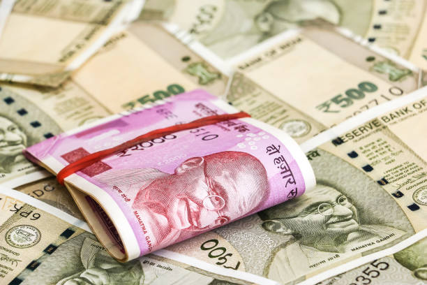 istock New indian 2000 rupees banknotes. 500 rupee banknotes in background. 1082531684