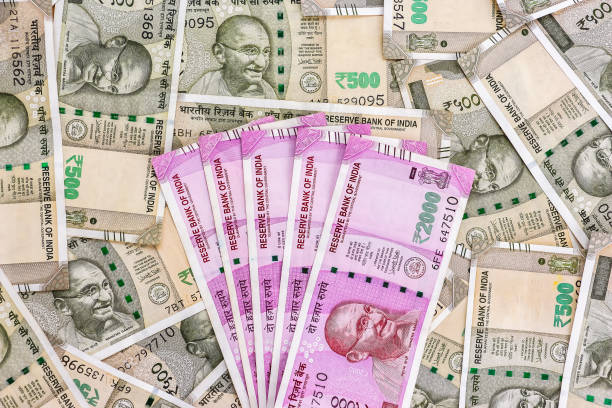 istock New indian 2000 rupees banknotes. 500 rupee banknotes in background. 1082534560
