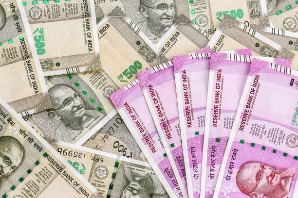 istock New indian 2000 rupees banknotes. 500 rupee banknotes in background. 1082534580