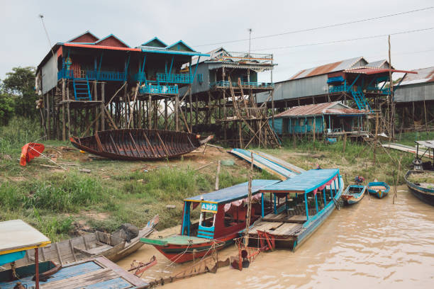 istock Abandoned Boat Moored By Buildings Against Sky 1082539024
