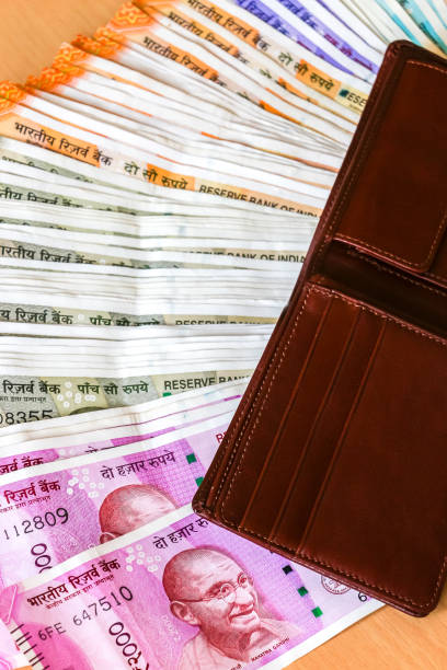 istock Leather wallet with brand new indian 10, 50, 100, 200, 500, 2000 rupees banknotes. 1082539056