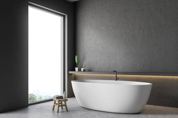 istock White tub in gray bathroom corner 1082542104
