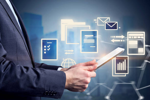 istock Businessman with tablet, night city documents 1082544052