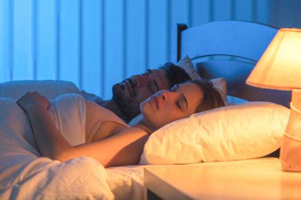 istock The couple sleeping in the bed. night time, full grip focus 1082546676