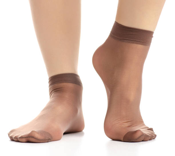 istock Female legs in mocha mocca nylon socks 1082548280