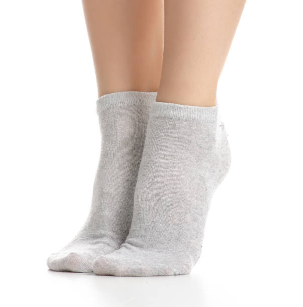 istock Female legs in gray socks 1082548600