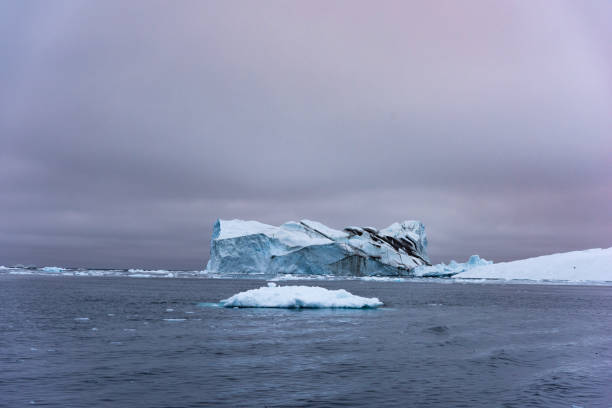 istock Massive Iceberg floating in Arctic Ocean in Greenland 1082548812