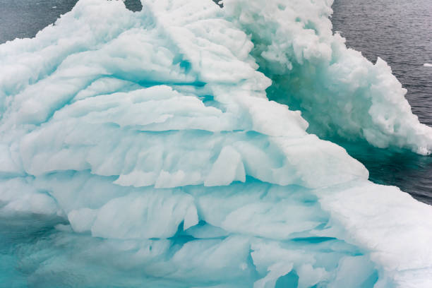 istock Massive Iceberg floating in Arctic Ocean in Greenland 1082548946