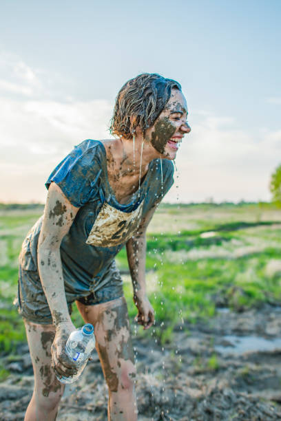 istock Woman in mud race 1082552346