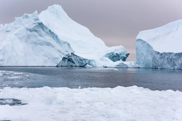 istock Massive Iceberg floating in Arctic Ocean in Greenland 1082554424