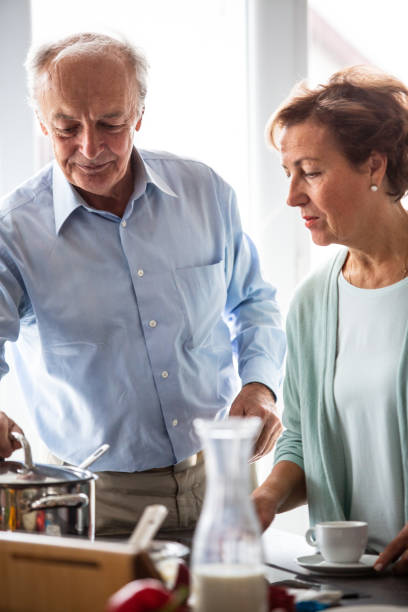 istock Senior couple cooking together 1082555702