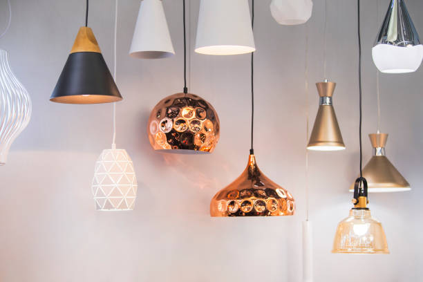 different modern streamlined mirror copper chandeliers. bubble metal copper shade pendant - light shop imagens e fotografias de stock