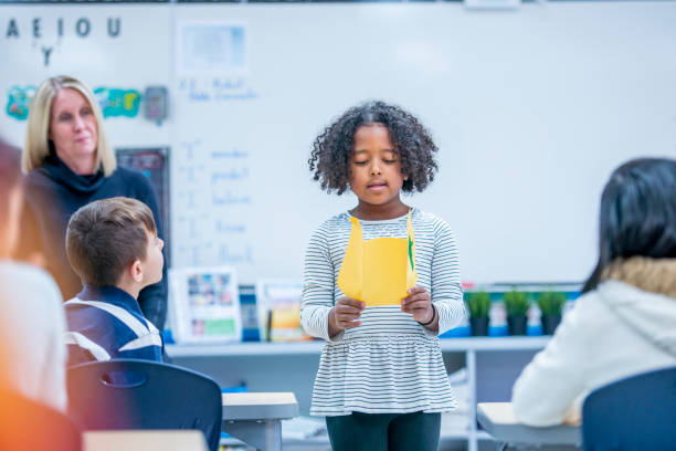 istock Little girl giving a presentation 1082558628