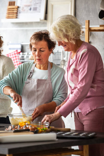 istock Two senior women cooking in the kitchen 1082561868