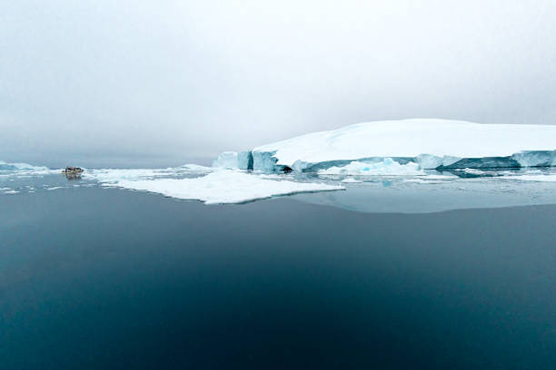 istock Massive Iceberg floating in Arctic Ocean in Greenland 1082562740
