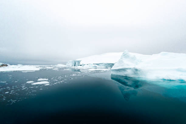 istock Massive Iceberg floating in Arctic Ocean in Greenland 1082564908