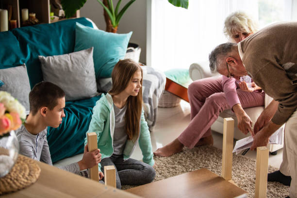 istock Family assembling furniture together 1082565188