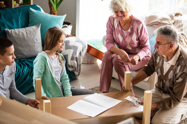 istock Family assembling furniture together 1082565262