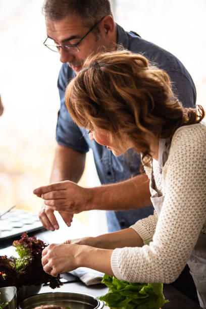 istock Man and woman cooking in the kitchen 1082565606