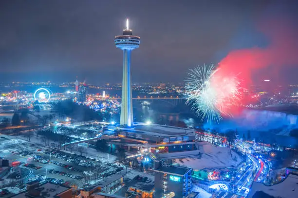 Stock photograph of fireworks in Niagara Falls Ontario Canada during winter time.