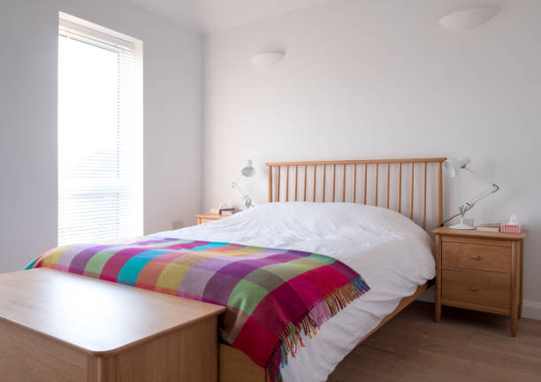 istock Minimalist, uncluttered bedroom interior 1082570594