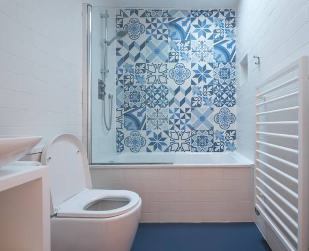 istock Small modern bathroom with blue and white tiles 1082570822