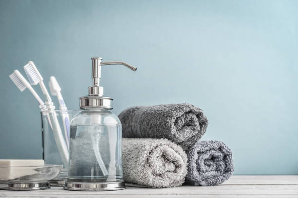 istock Bathroom set with toothbrushes, towels and soap 1082577102