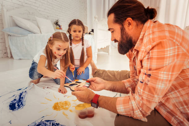 istock Nice handsome man looking at the colour palette 1082577454