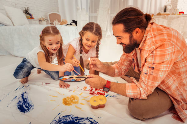 istock Cheerful delighted bearded man enjoying his time 1082577488