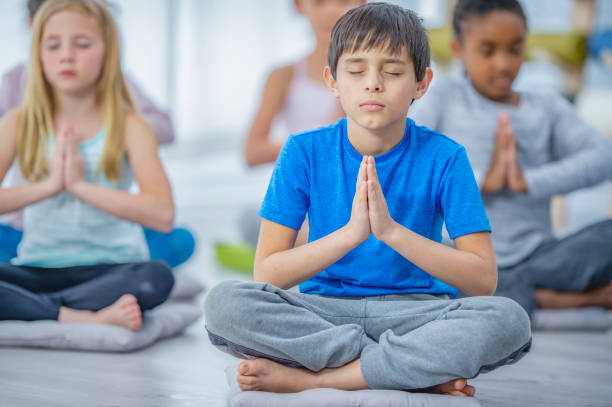 istock Kid's yoga class 1082578298